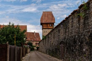 pexels-photo-26612895-26612895 Scenic view of Bauerlin Tower and medieval alley in Dinkelsbühl's old town.